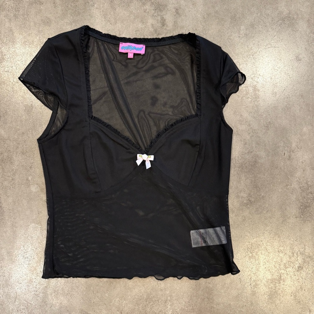 Black going out top